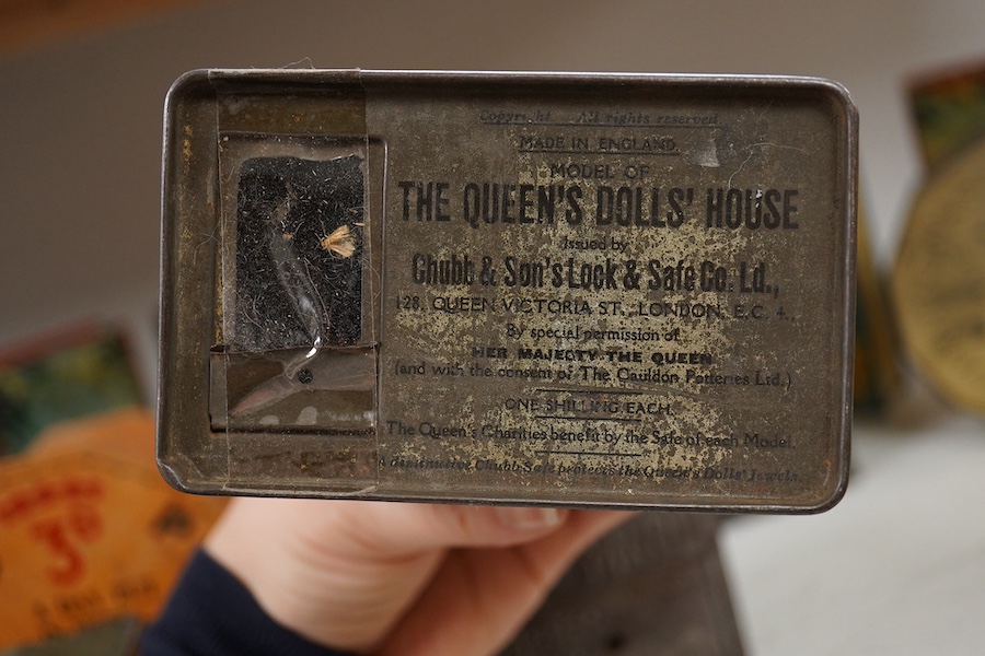 A quantity of various painted tin money boxes including Lucie Attwell Fairy House, The ‘Daily Mail’ copper bank, and four in the form of books, largest 20cm high. Condition - mostly fair